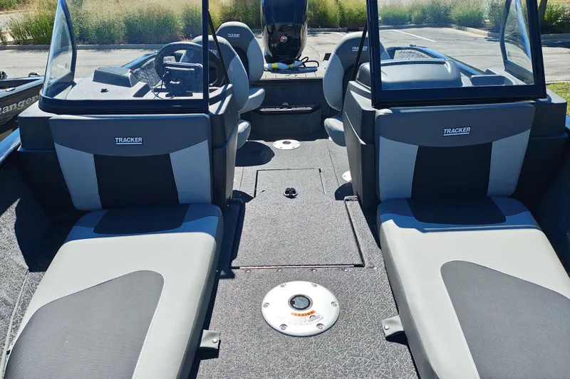 Slide: The Image of 2027 Tracker Pro Guide V-175 Combo boat interior with seating and steering console. - 27