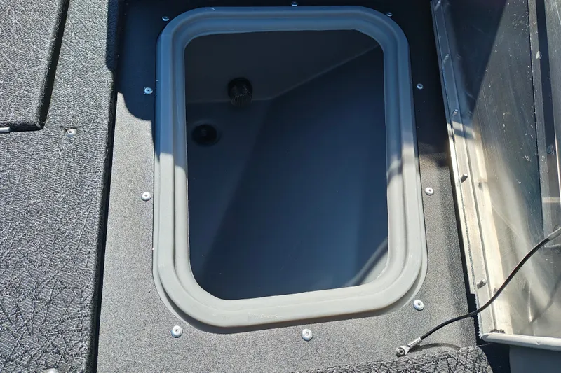 Slide: The Image of Open storage compartment on 2027 Tracker Pro Guide V-175 Combo boat. - 31