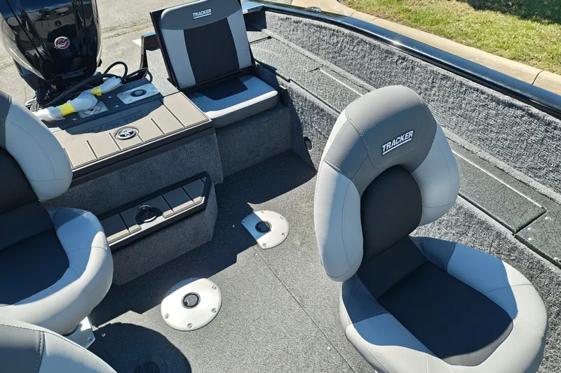 Slide: The Image of 2027 Tracker Pro Guide V-175 Combo boat interior with gray seating and motor. - 34
