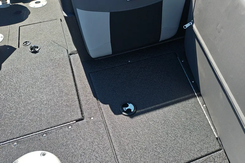 Slide: The Image of Interior of 2027 Tracker Pro Guide V-175 Combo boat, featuring textured flooring and seating. - 30