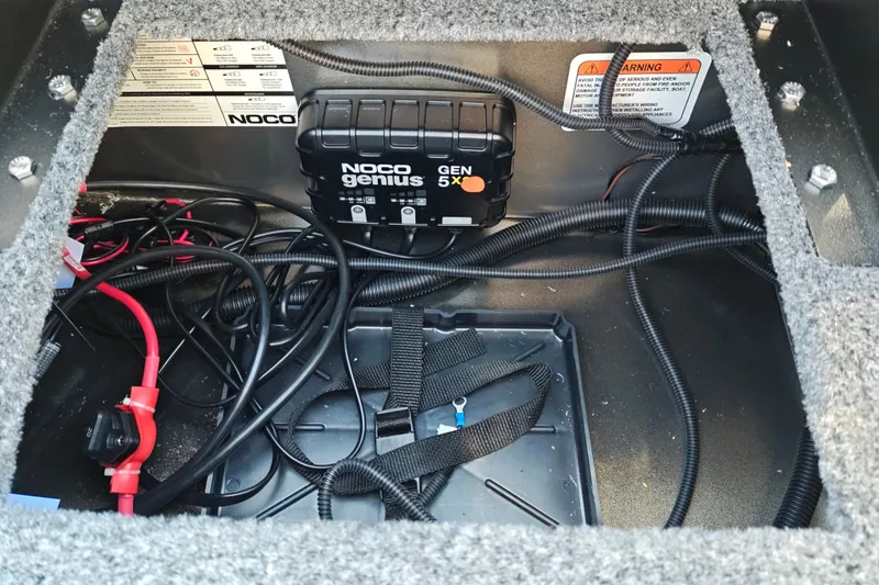 Slide: The Image of Interior of 2027 Tracker Pro Guide V-175 Combo with NOCO Genius GEN5X battery charger. - 42