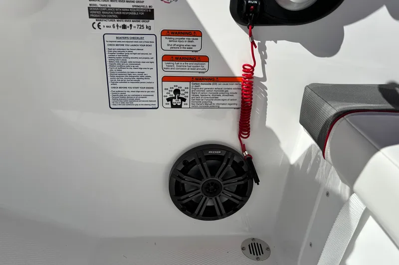 Slide: The Image of Interior of 2027 Tahoe T16 boat with safety warnings and speaker. - 8