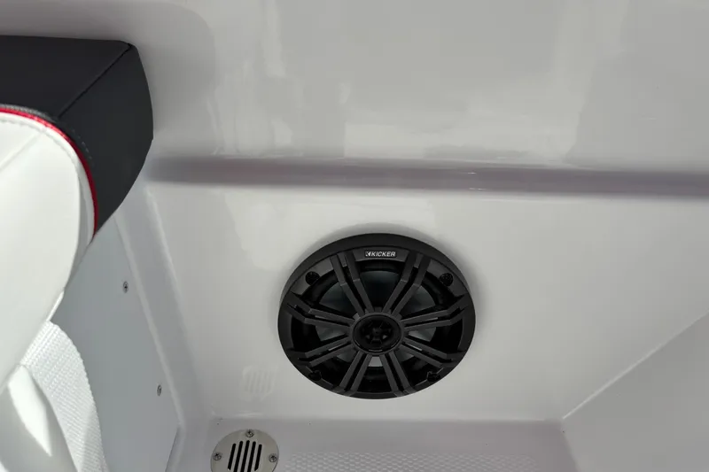 Slide: The Image of 2027 Tahoe T16 boat interior with Kicker speaker and white seating. - 9