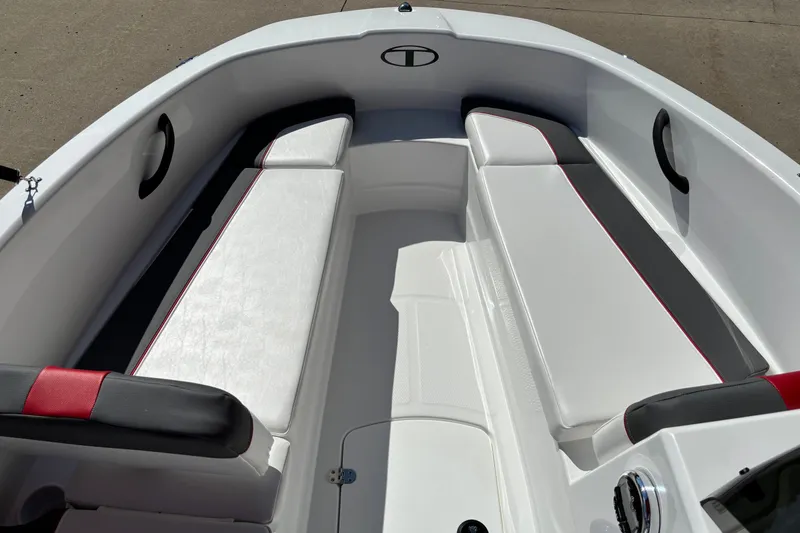 Slide: The Image of 2027 Tahoe T16 boat interior with white and black seating, red accents. - 3