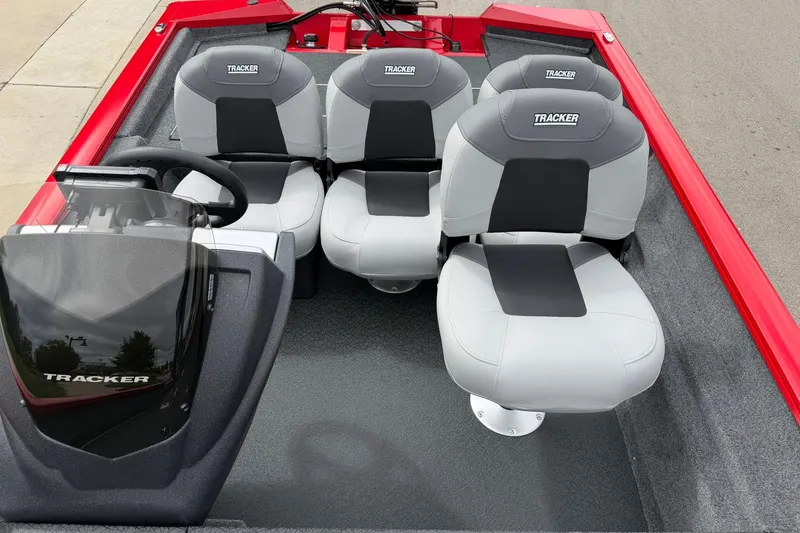 Slide: The Image of 2027 Tracker Pro Team 175 Crappie Edition boat interior with gray and black seating. - 14
