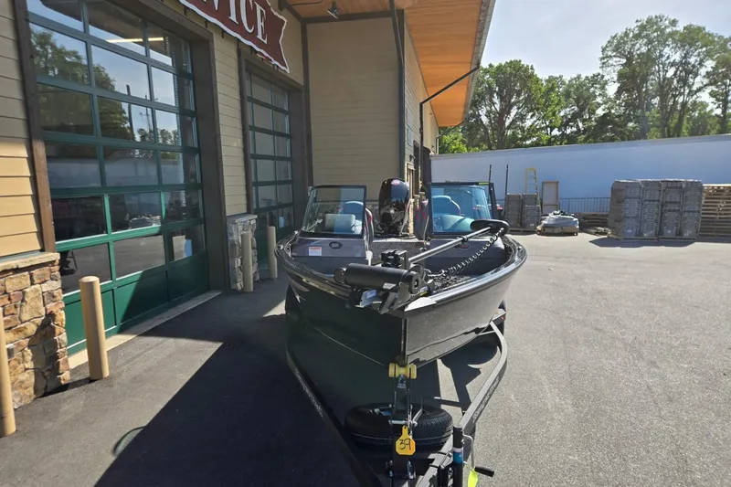 Slide: The Image of 2026 Ranger VS1882SC Angler boat parked outside a service center. - 3
