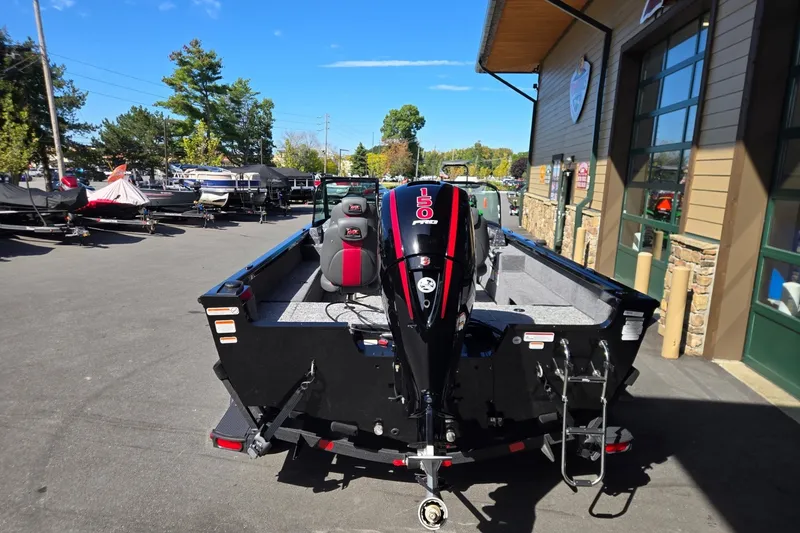 Slide: The Image of 2026 Ranger VS1882SC Angler boat with powerful outboard motor, parked outdoors. - 4