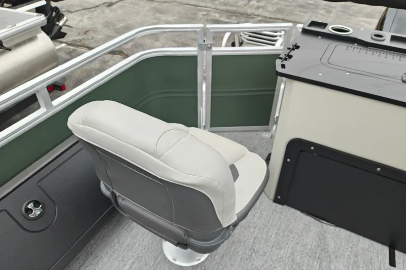 Slide: The Image of 2027 Sun Tracker Fishin' Barge 22 XP3 boat interior with swivel seat and console. - 32