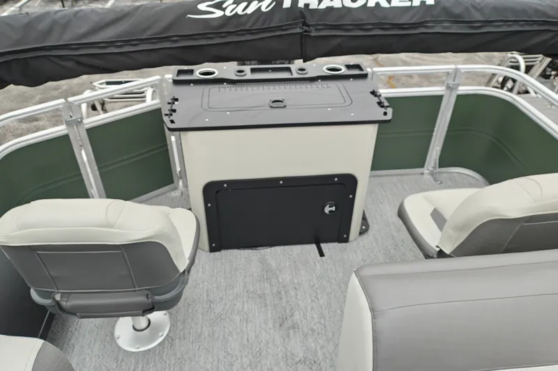 Slide: The Image of 2027 Sun Tracker Fishin' Barge 22 XP3 interior with seating and control panel. - 30