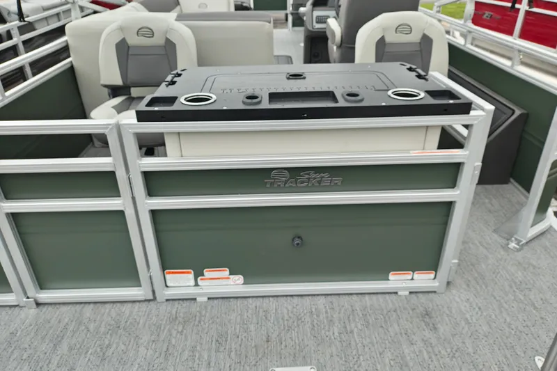 Slide: The Image of 2027 Sun Tracker Fishin' Barge 22 XP3 interior with seating and storage compartments. - 40