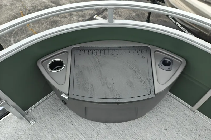 Slide: The Image of 2027 Sun Tracker Fishin' Barge 22 XP3 fishing station with measuring board and cup holders. - 45