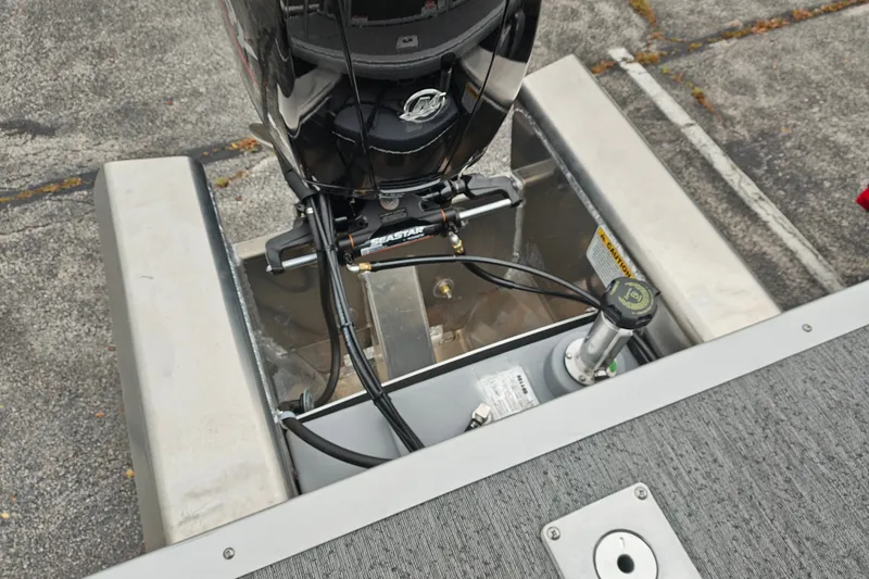 Slide: The Image of Rear view of a 2027 Sun Tracker Fishin' Barge 22 XP3 boat engine setup. - 39