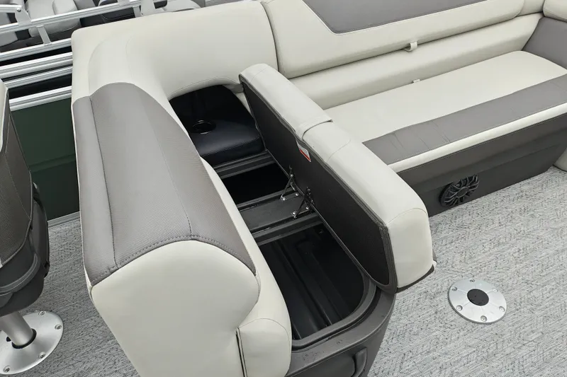 Slide: The Image of 2027 Sun Tracker Fishin' Barge 22 XP3 interior with open storage compartment and seating. - 19