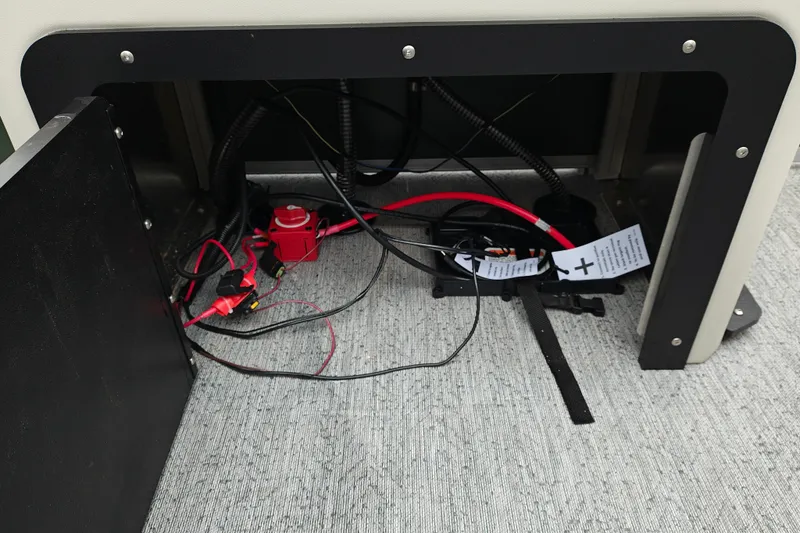 Slide: The Image of Sun Tracker Fishin' Barge 22 XP3 2027 wiring compartment with cables and connections. - 34