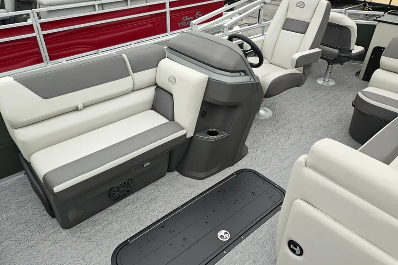 Slide: The Image of 2027 Sun Tracker Fishin' Barge 22 XP3 interior with plush seating and modern helm. - 13