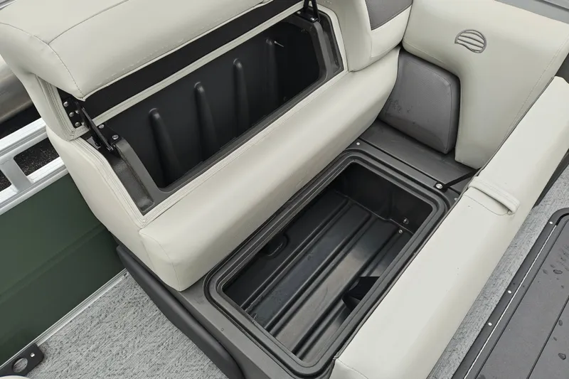 Slide: The Image of Open storage compartment on 2027 Sun Tracker Fishin' Barge 22 XP3 boat seat. - 14
