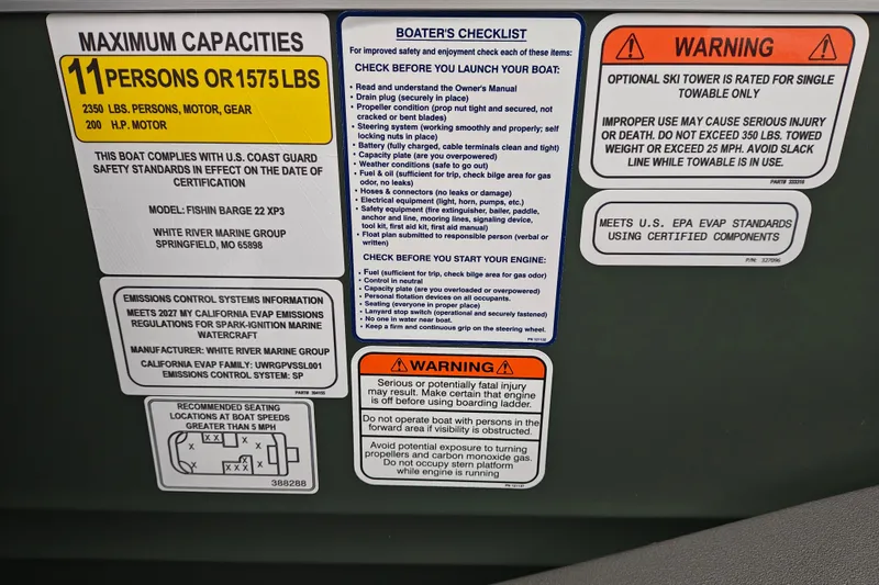 Slide: The Image of Sun Tracker Fishin' Barge 22 XP3 2027 capacity and safety instructions panel. - 27