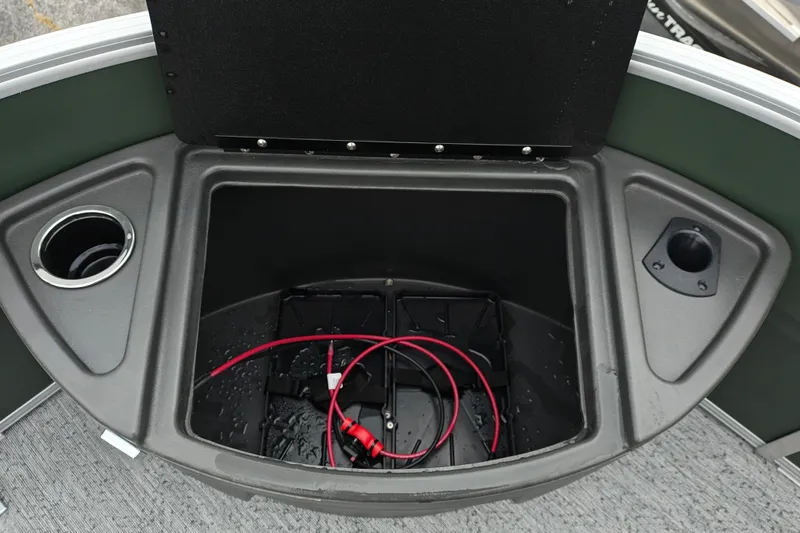 Slide: The Image of Storage compartment on 2027 Sun Tracker Fishin' Barge 22 XP3 with cup holder and wiring. - 46