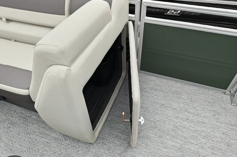 Slide: The Image of 2027 Sun Tracker Fishin' Barge 22 XP3 seat storage compartment open, showcasing interior space. - 16