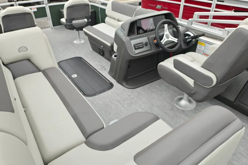 Slide: The Image of Interior of 2027 Sun Tracker Fishin' Barge 22 XP3, featuring comfortable seating and modern controls. - 42