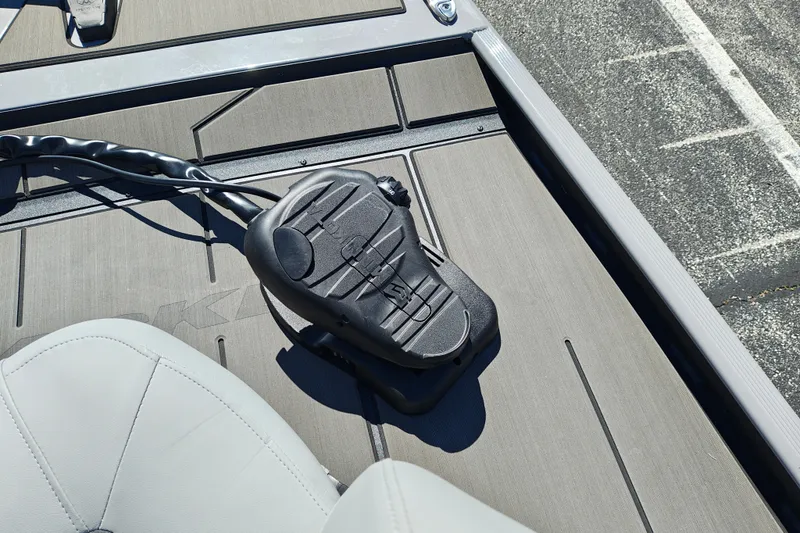 Slide: The Image of 2027 Tracker Pro 170 boat deck with foot pedal control and seating. - 22