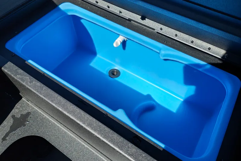 Slide: The Image of Blue livewell in 2027 Tracker Pro 170 boat, open lid view. - 26
