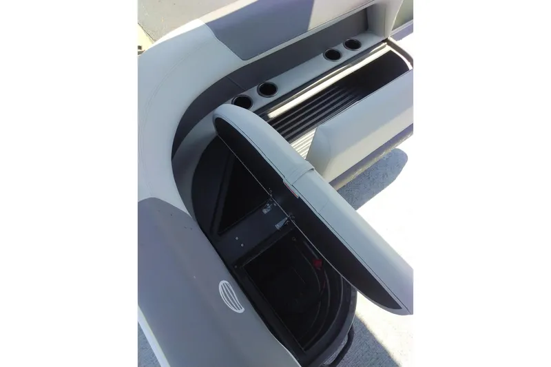 Slide: The Image of 2027 Sun Tracker Bass Buggy 16 XL Select boat seating with storage compartment open. - 14