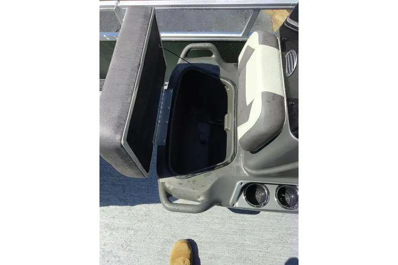 Slide: The Image of Open storage compartment on 2027 Sun Tracker Bass Buggy 16 XL Select boat. - 15