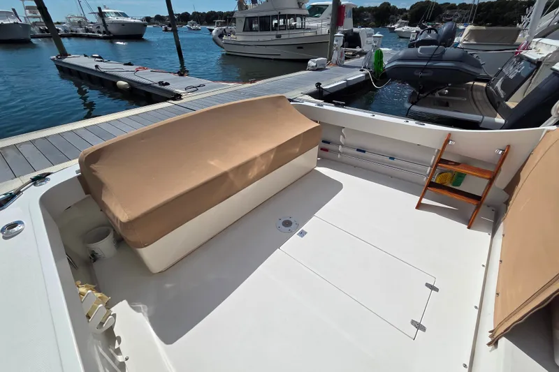Slide: The Image of Spacious deck of 1999 Fortier Express 33 boat docked at marina. - 18