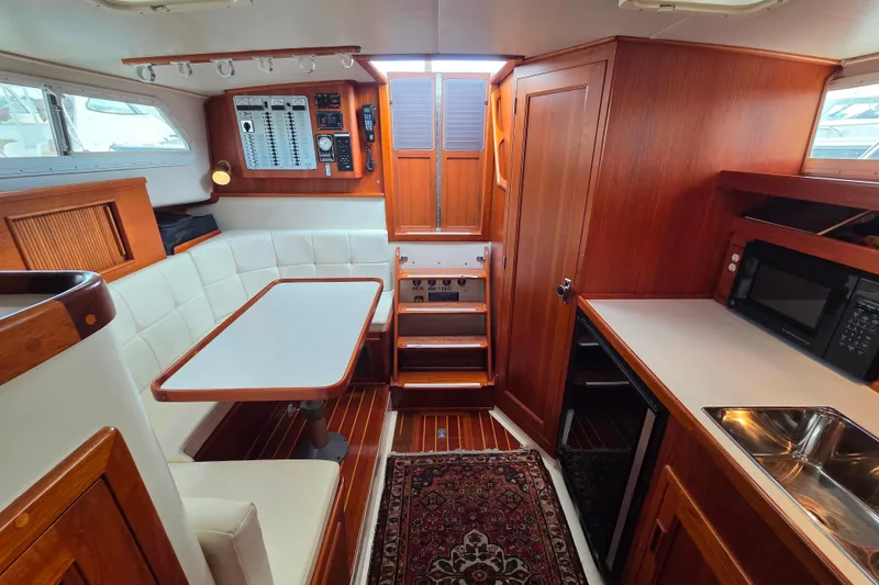 Slide: The Image of Interior of 1999 Fortier Express 33 yacht with wood finish and modern amenities. - 20