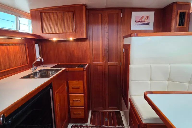 Slide: The Image of Luxurious 1999 Fortier Express 33 yacht interior with wood cabinetry and modern amenities. - 26