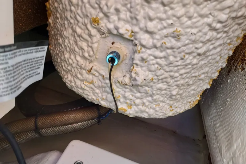 Slide: The Image of Close-up of a 2018 Cobia 220 Center Console boat's wiring and textured surface. - 16