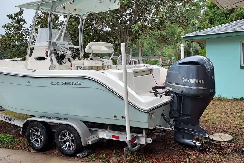 Slide: The Image of 2018 Cobia 220 Center Console boat with Yamaha engine on trailer. - 3