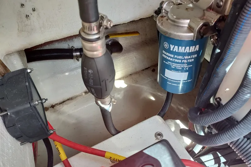 Slide: The Image of Yamaha marine fuel/water separator in 2018 Cobia 220 Center Console boat engine compartment. - 17