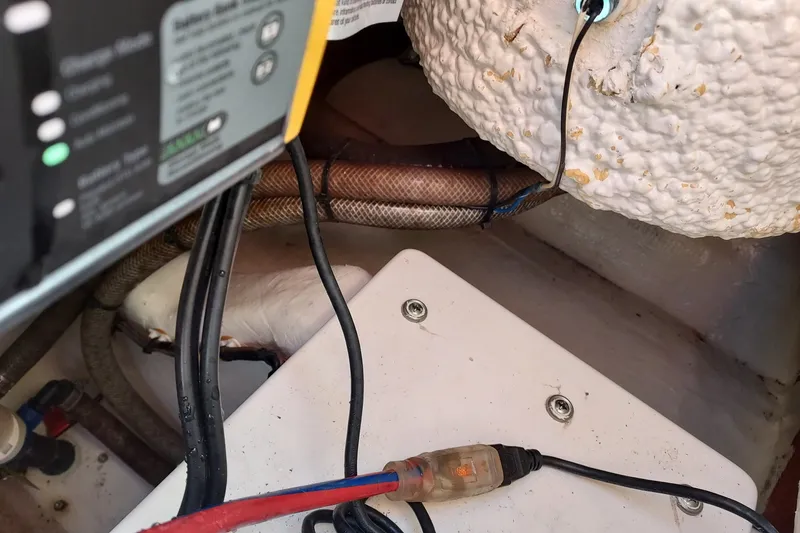 Slide: The Image of Electrical wiring and components inside a 2018 Cobia 220 Center Console boat. - 15