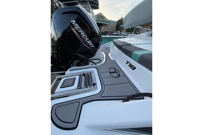 Slide: The Image of 2026 Tahoe T18 boat with Mercury engine, featuring sleek design and modern seating. - 8