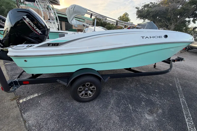 The Image of 2026 Tahoe T18 boat on trailer, featuring sleek design and Mercury engine. - 0