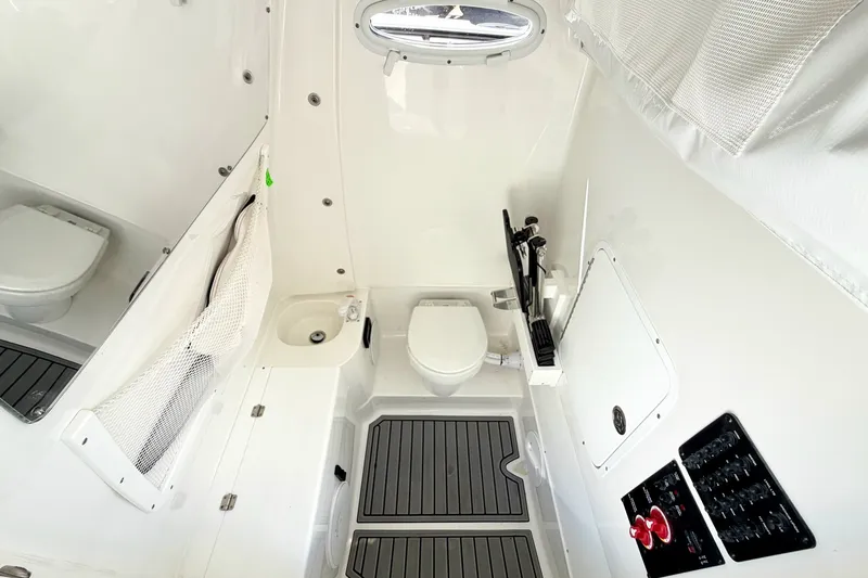 Slide: The Image of Interior of 2026 Sea Hunt Gamefish 30CB boat bathroom with modern amenities. - 31