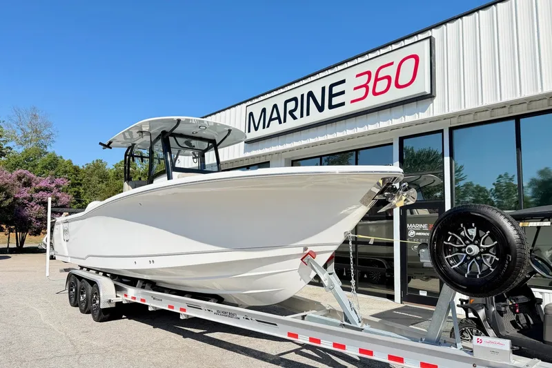 The Image of 2026 Sea Hunt Gamefish 30CB boat on trailer at Marine 360 dealership. - 1