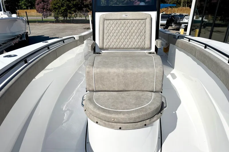 Slide: The Image of 2026 Sea Hunt Gamefish 30CB boat interior with cushioned seating and sleek design. - 26