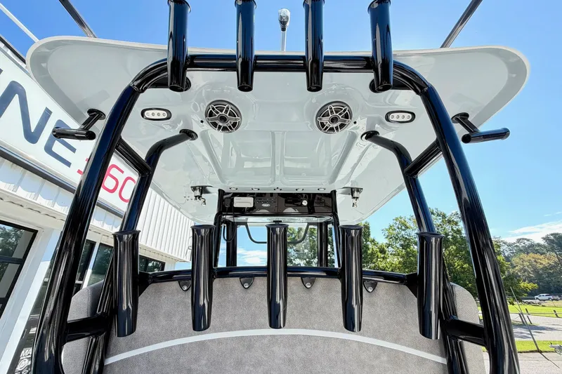 Slide: The Image of 2026 Sea Hunt Gamefish 30CB boat with rod holders and speakers, viewed from below. - 15