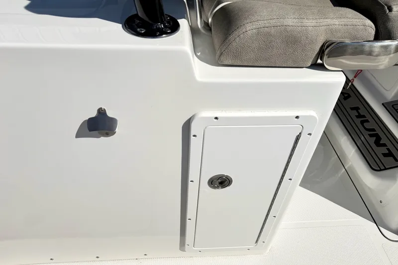 Slide: The Image of 2026 Sea Hunt Gamefish 30CB boat detail, featuring a storage compartment and seating area. - 22
