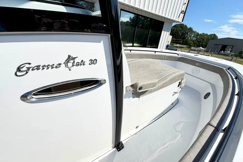 Slide: The Image of 2026 Sea Hunt Gamefish 30CB boat, showcasing sleek design and comfortable seating. - 24