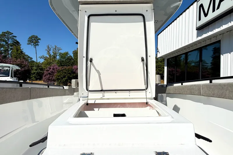 Slide: The Image of 2026 Sea Hunt Gamefish 30CB boat storage compartment open, showcasing spacious interior. - 28