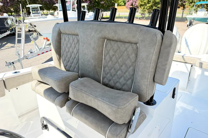 Slide: The Image of 2026 Sea Hunt Gamefish 30CB boat seating with diamond-stitched upholstery and armrests. - 18