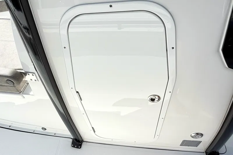 Slide: The Image of 2026 Sea Hunt Gamefish 30CB boat hatch door, sleek white design. - 30