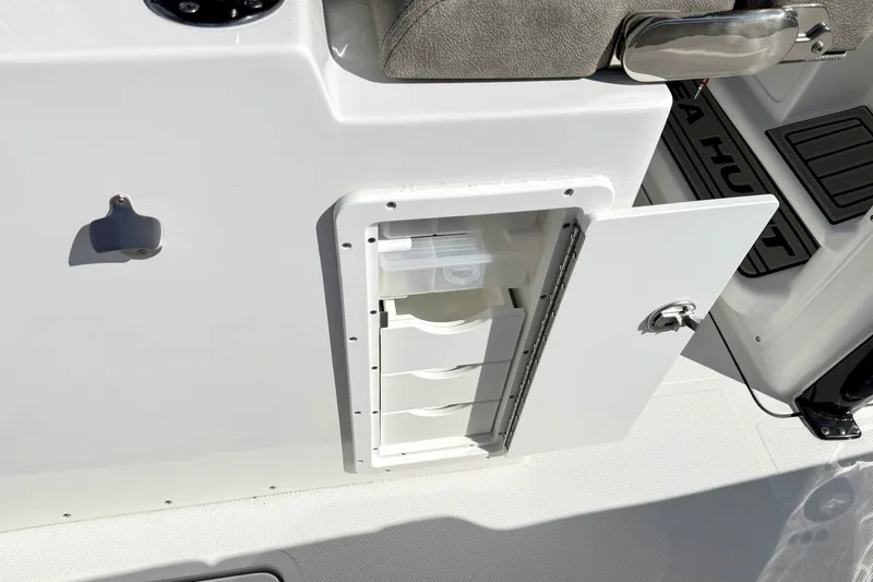 Slide: The Image of Open storage compartment on 2026 Sea Hunt Gamefish 30CB boat. - 23