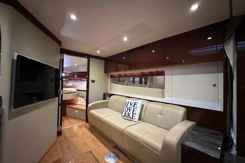 Slide: The Image of Luxurious interior of 2014 Sea Ray 410 Sundancer yacht with beige sofa and modern decor. - 21