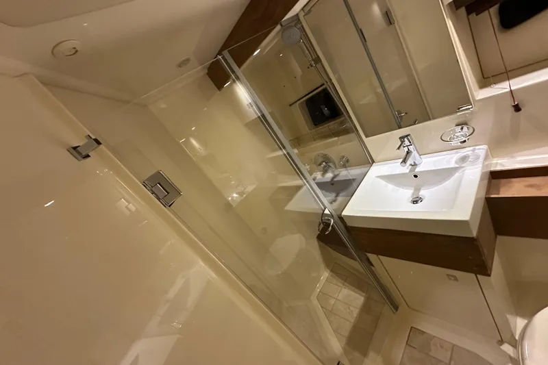 Slide: The Image of Luxurious bathroom interior of 2014 Sea Ray 410 Sundancer yacht with modern fixtures. - 33