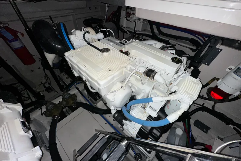 Slide: The Image of Engine room of a 2014 Sea Ray 410 Sundancer boat, showcasing mechanical components. - 40